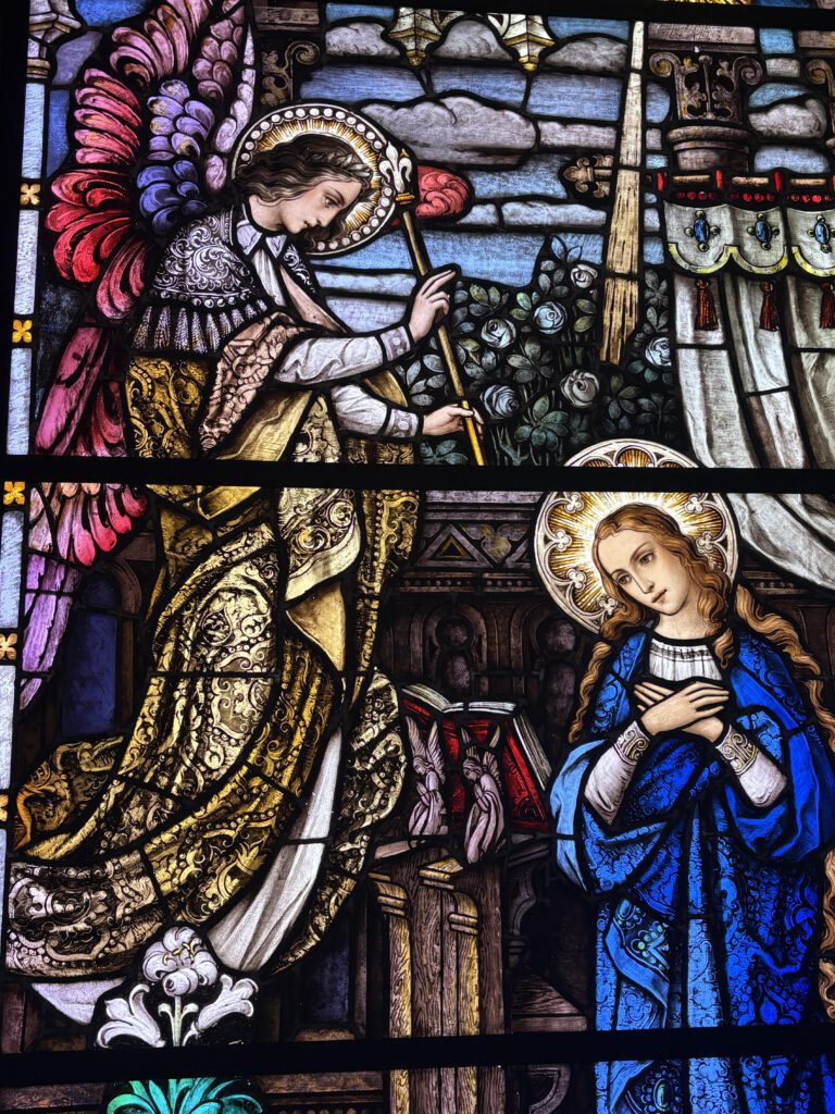 Angel Gabriel appearing to the Virgin Mary at the Annunciation, announcing the birth of Jesus.